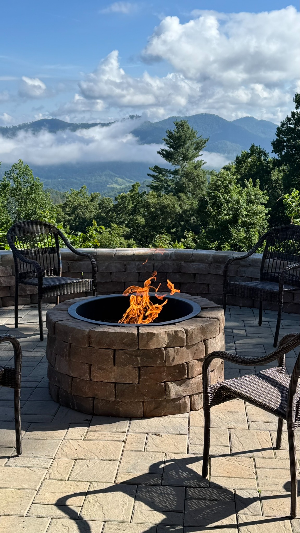 Fire pit patio with clouds above the distant mountain ridgeline